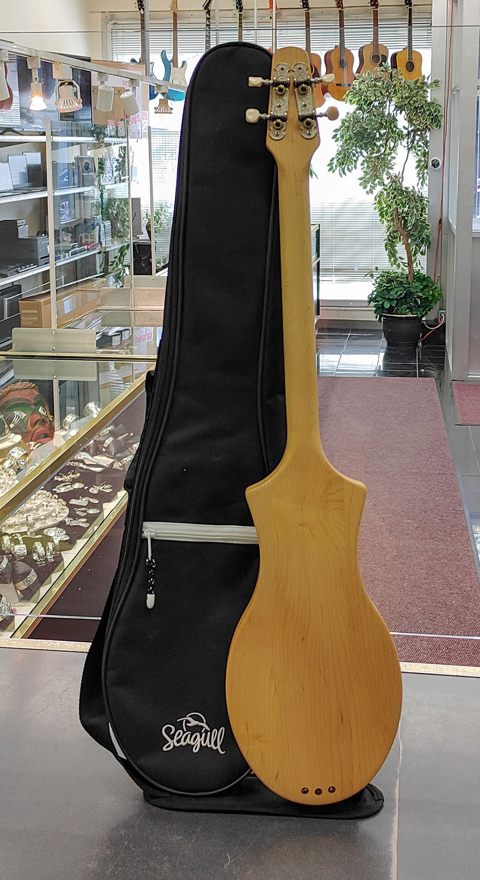 Seagull M4 Diatonic 4-string Spruce acoustic instrument in natural finish with original Seagull carry case, made in Canada