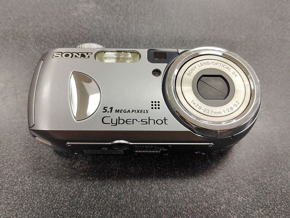 Thumbnail: Silver Sony Cyber-shot DSC-P93A camera with 32MB Memory Stick and AA batteries