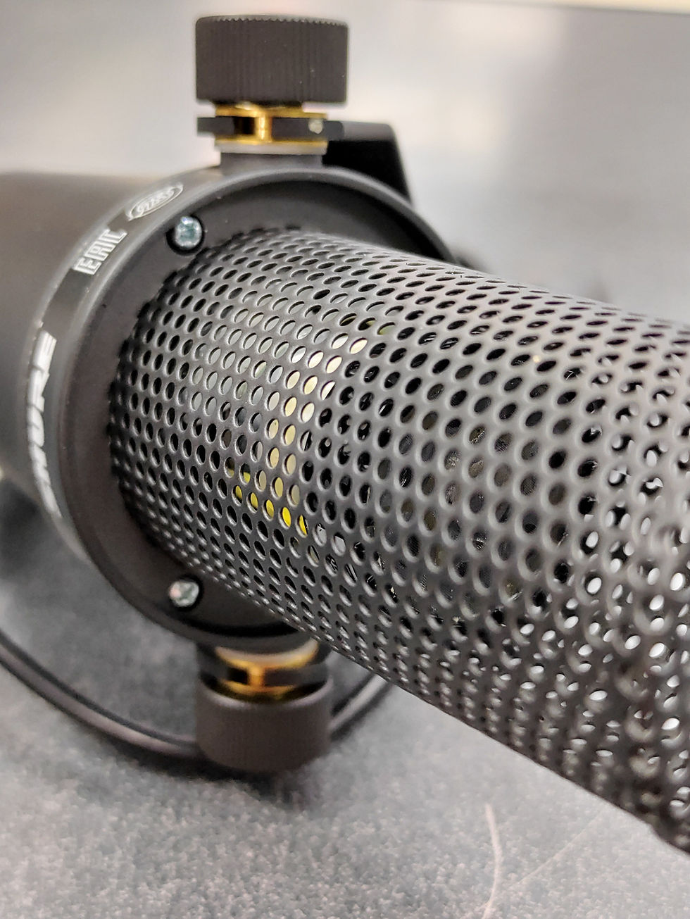 Thumbnail: Shure SM7B XLR dynamic microphone with yoke mount, foam windscreen, rear controls, and XLR connector.