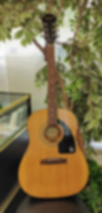 Epiphone AJ-100NA natural finish acoustic guitar showing full body, headstock, bridge, back, sides, tuners, and minor cosmeti