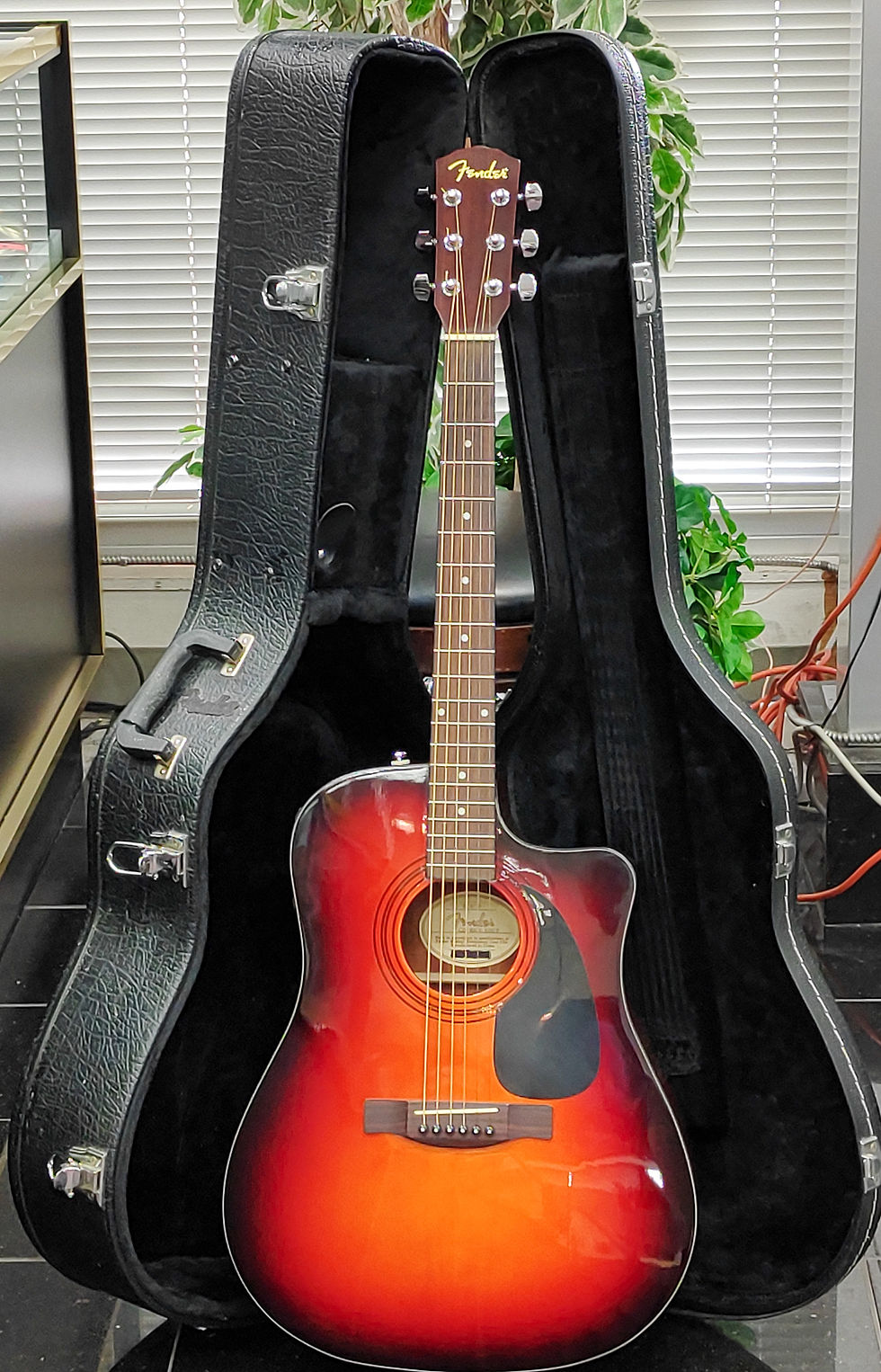 Fender CD-60CE SBST acoustic-electric guitar in sunburst finish, close-up showing a fine finish check line in the clear coat