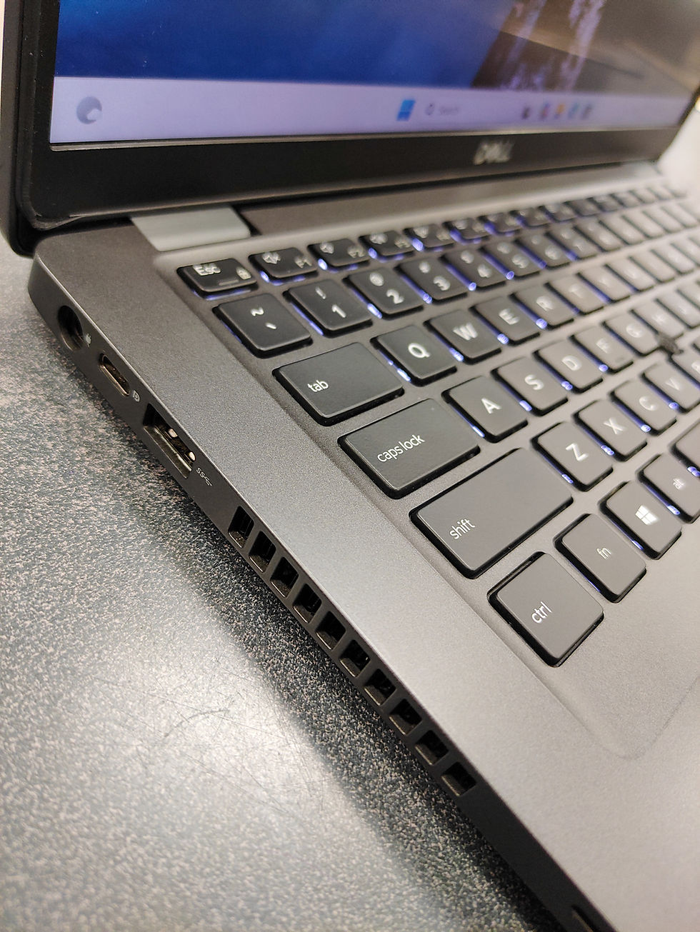 Thumbnail: Dell Latitude 5400 gray business laptop with touchscreen display, backlit keyboard, and original Dell 65W charger