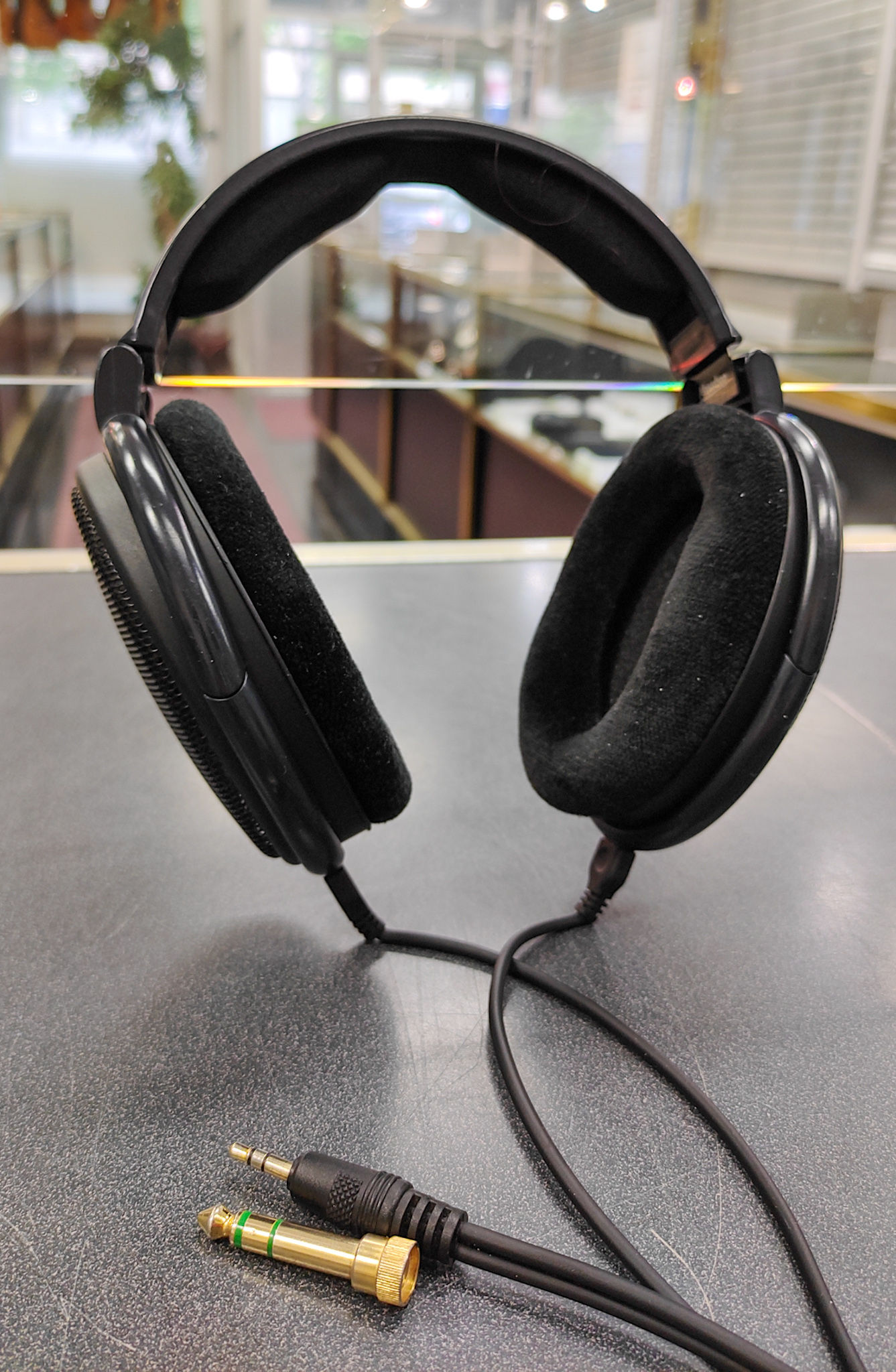 Sennheiser x Massdrop HD 6XX open-back wired headphones in black with velour ear pads, attached cable, and 1/4 inch adapter