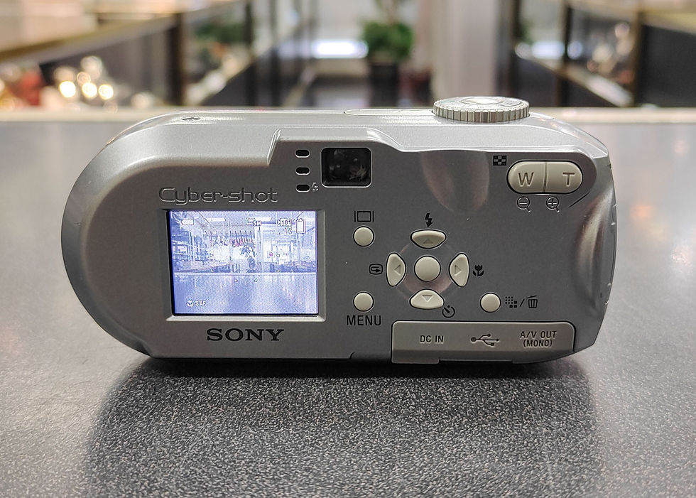 Thumbnail: Silver Sony Cyber-shot DSC-P93A camera with 32MB Memory Stick and AA batteries