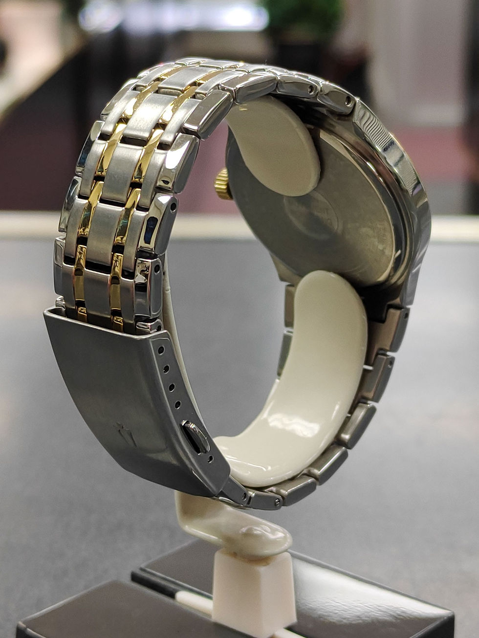 Thumbnail: Bulova 98C60 two-tone stainless steel watch with champagne dial and date shown from front, side, and caseback