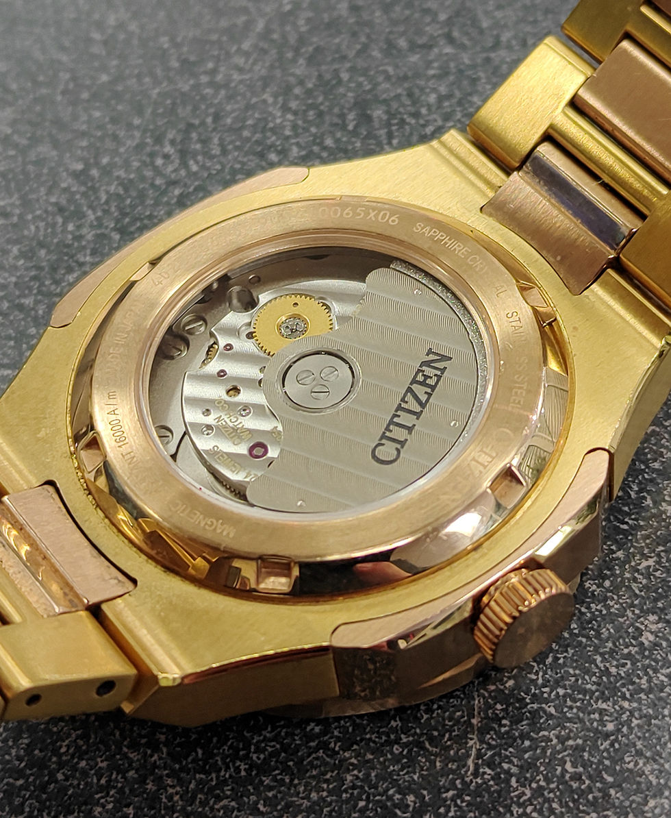 Thumbnail: Citizen Series 8 Automatic GMT gold-tone and rose-tone stainless steel watch with black textured dial, green and black 24-hou