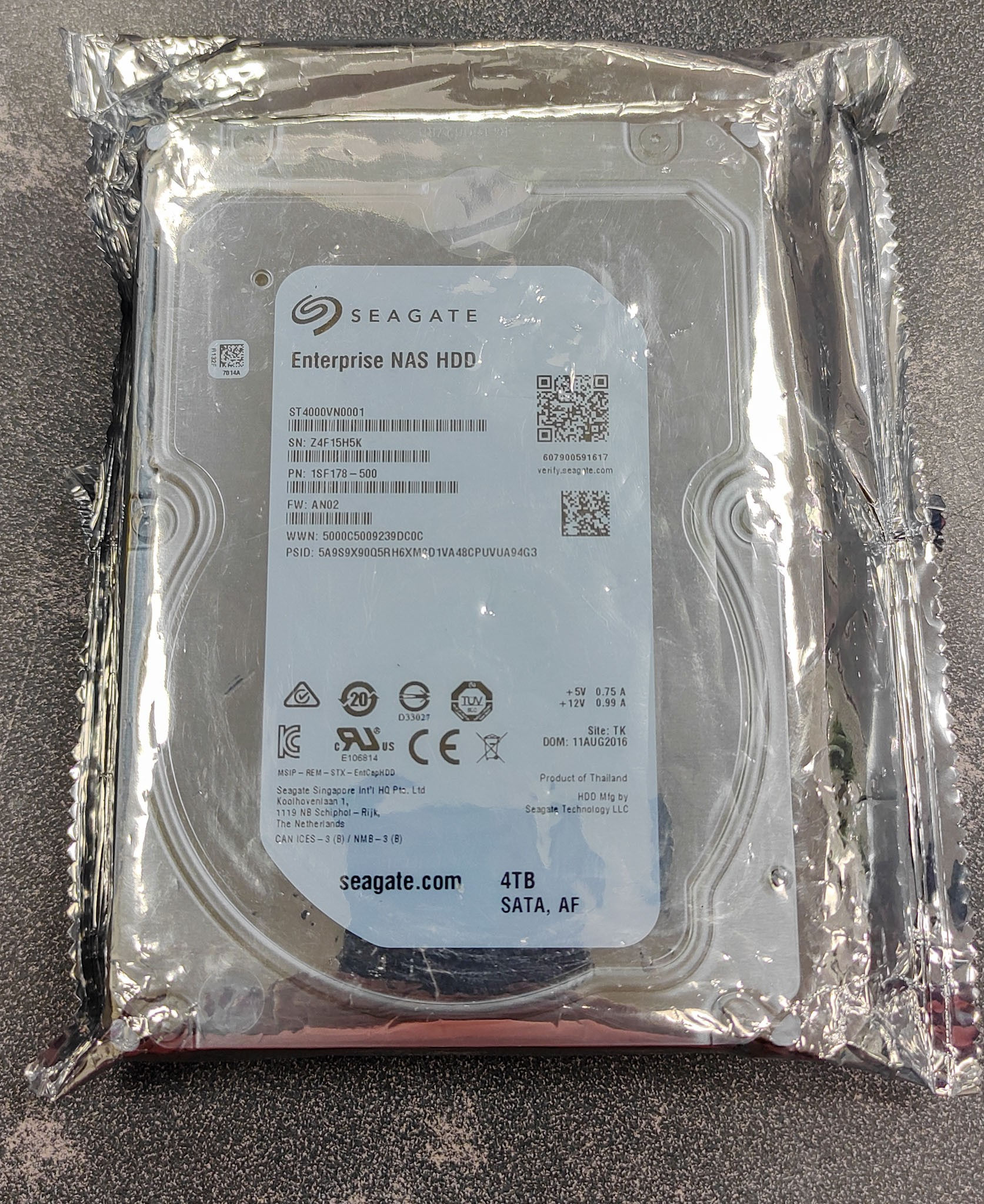 Seagate ST4000VN0001 4TB Enterprise NAS HDD shown sealed in original anti-static packaging with visible model label, SATA con