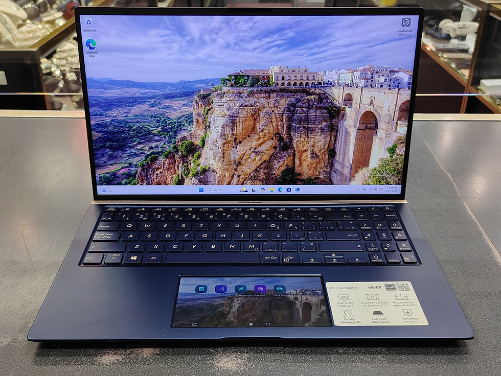 Asus ZenBook 15 UX534F laptop open on a counter, showing 15.6" FHD display and ScreenPad touch display in the touchpad area