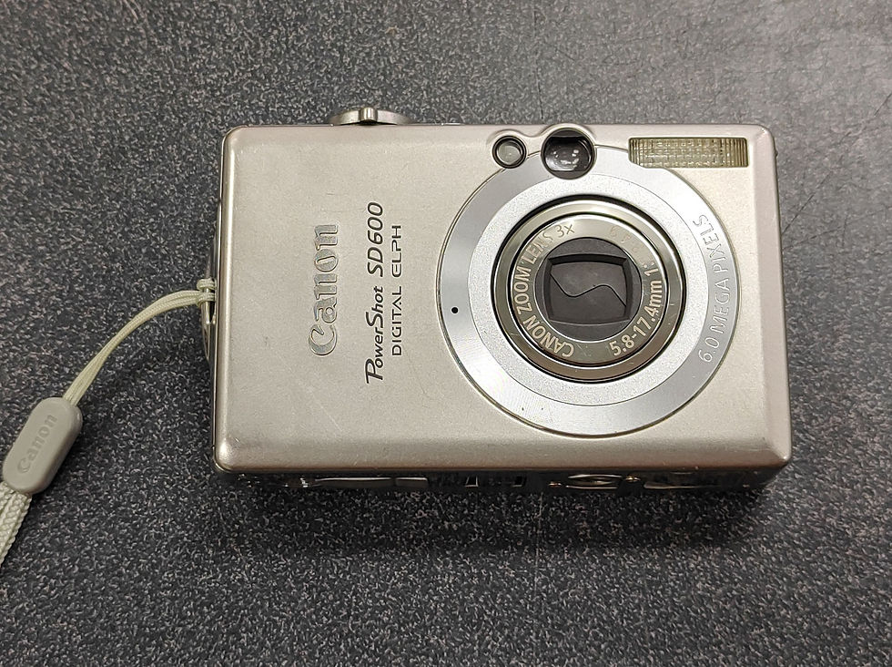 Thumbnail: Silver Canon PowerShot SD600 digital camera with battery, charger, SD card and strap