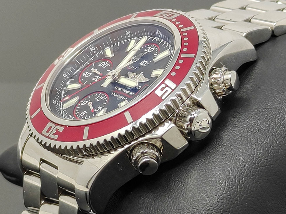 Thumbnail: Brand new Breitling Superocean Chronograph II with red bezel, black Abyss dial, and stainless steel bracelet, limited edition