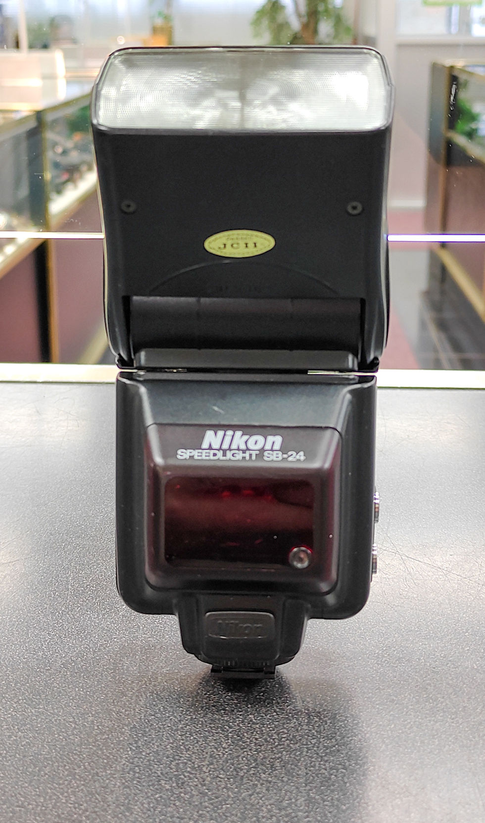 Nikon Speedlight SB-24 flash unit shown from multiple angles with LCD display