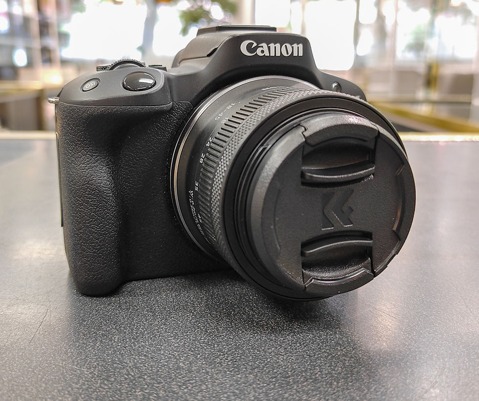 Thumbnail: Canon EOS R50 mirrorless camera with RF-S 18-45mm IS STM lens, Canon LP-E17 battery, and Canon battery charger mint condition