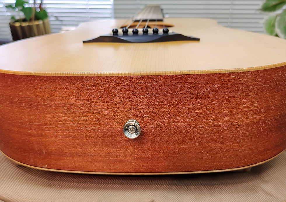 Thumbnail: Taylor Baby Taylor natural acoustic guitar with original tan Taylor gig bag and visible cosmetic headstock wear
