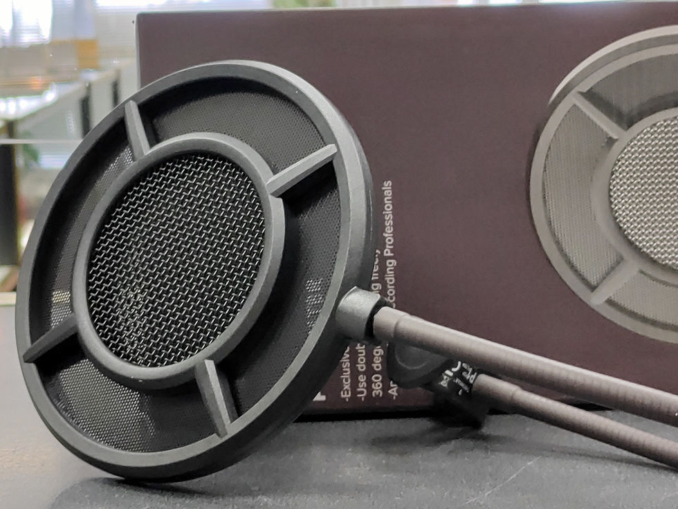 Thumbnail: Primacoustic VoxGuard acoustic shield mounted on a mic stand, alongside a Thronmax pop filter with dual-mesh screens.