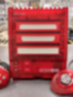 Translucent red Hyperkin RetroN 3 HD console front view showing cartridge slots and power/reset buttons