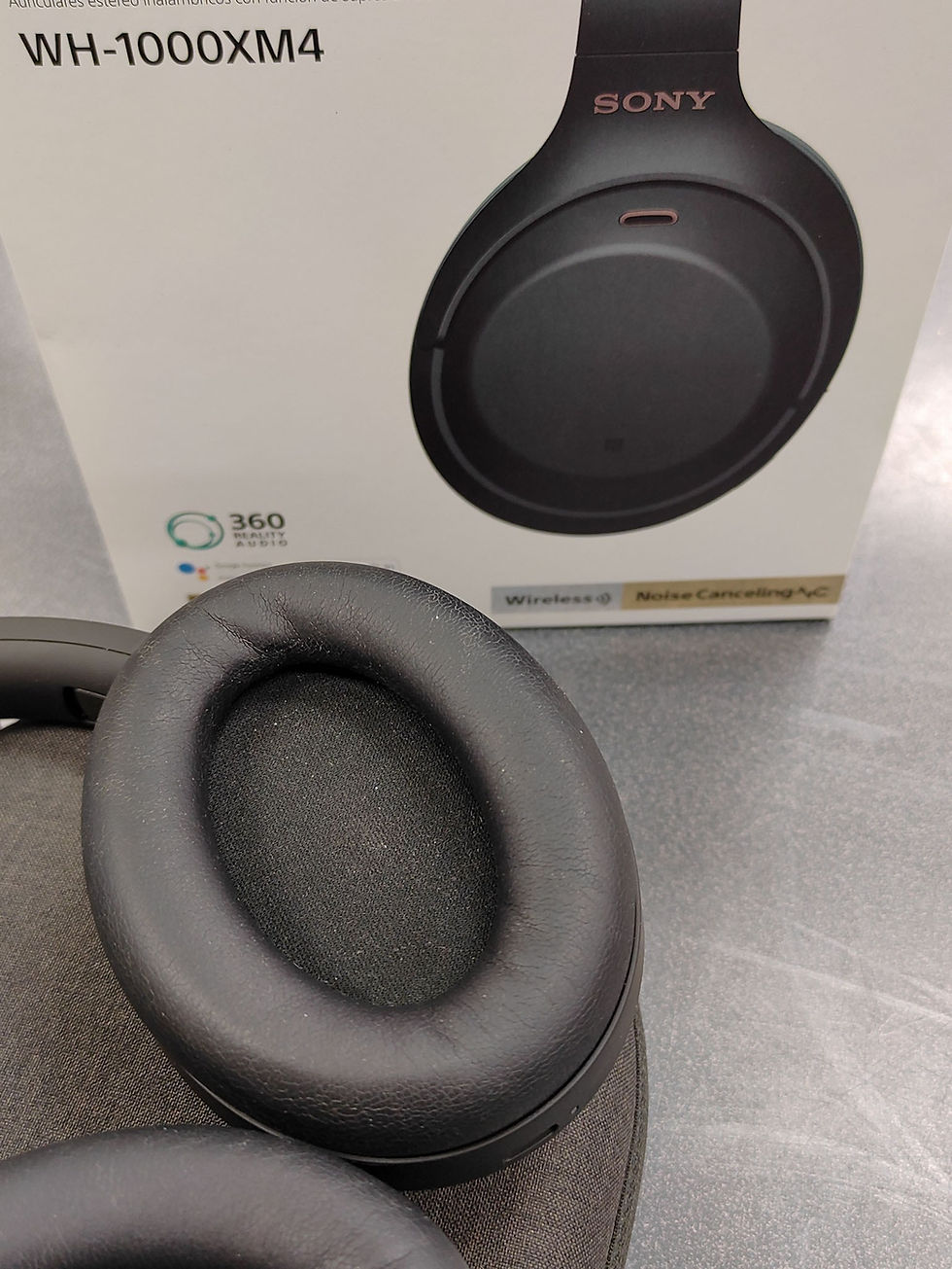 Thumbnail: Sony WH-1000XM4 black wireless noise cancelling headphones with original box, carry case, cables, adapter, and paperwork