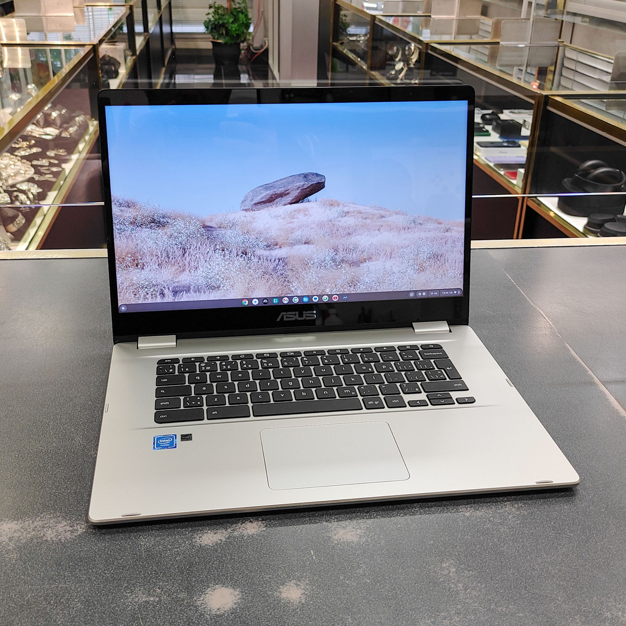 Silver ASUS C523NA 15.6-inch touchscreen Chromebook with original charger