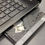 Thumbnail: HP 15-da0046nr 15.6-inch touchscreen laptop open on a counter, showing keyboard and trackpad with worn coating