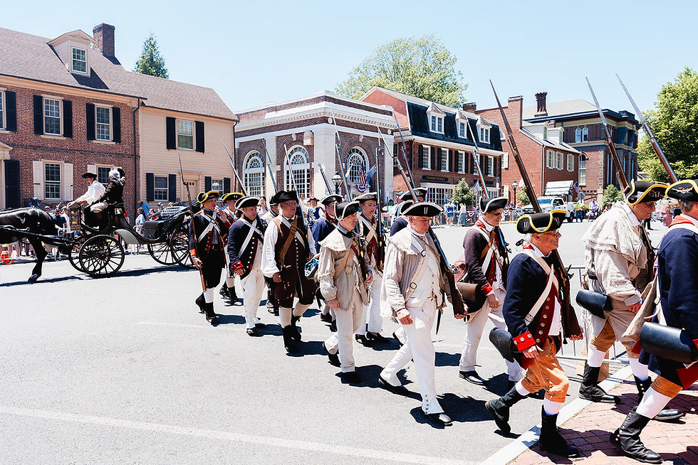 The 1st Delaware Regiment files out of the street as Caesar Rodney and the 250Ride.org carriage depart Historic New Castle, continuing the journey toward Philadelphia.