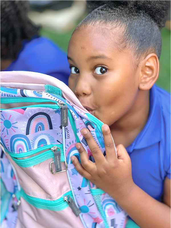 girl kissing backpack_edited.png