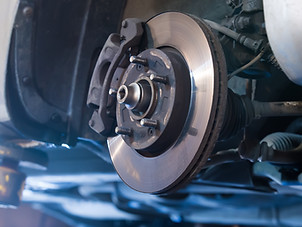 Car brake disc without wheels closeup.jp