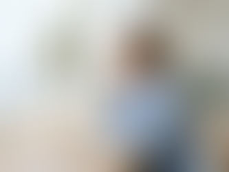 woman at desk by window