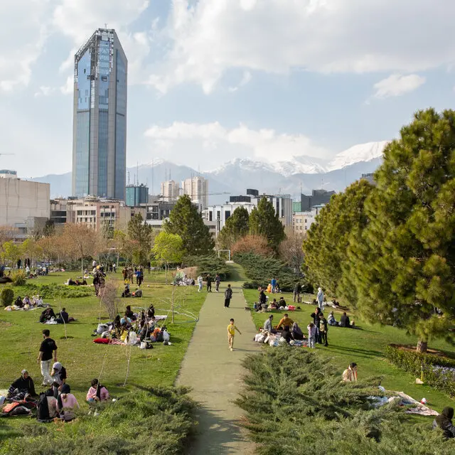 Residents of Tehran spent Sizdah Bedar, a festival marking the 13th day of the Persian new year, outdoors in the capital city. Numerous families picnicked near Tabiat Bridge, which connects two large parks, in the shadow of a building bearing scars from last year’s bombardment of the city. Arash Khamooshi for The New York Times