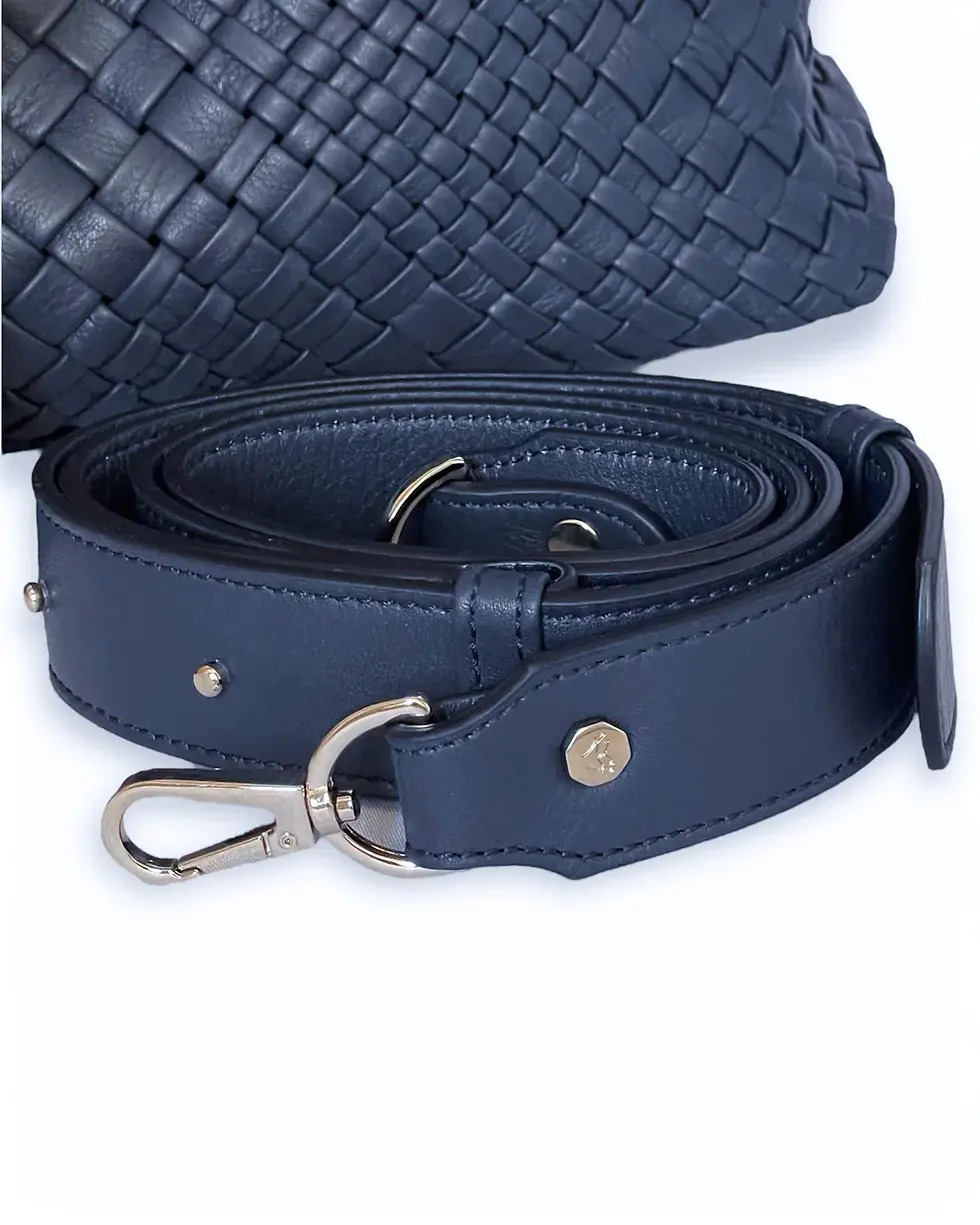 Thumbnail: Detachable leather strap of a woven navy tote bag