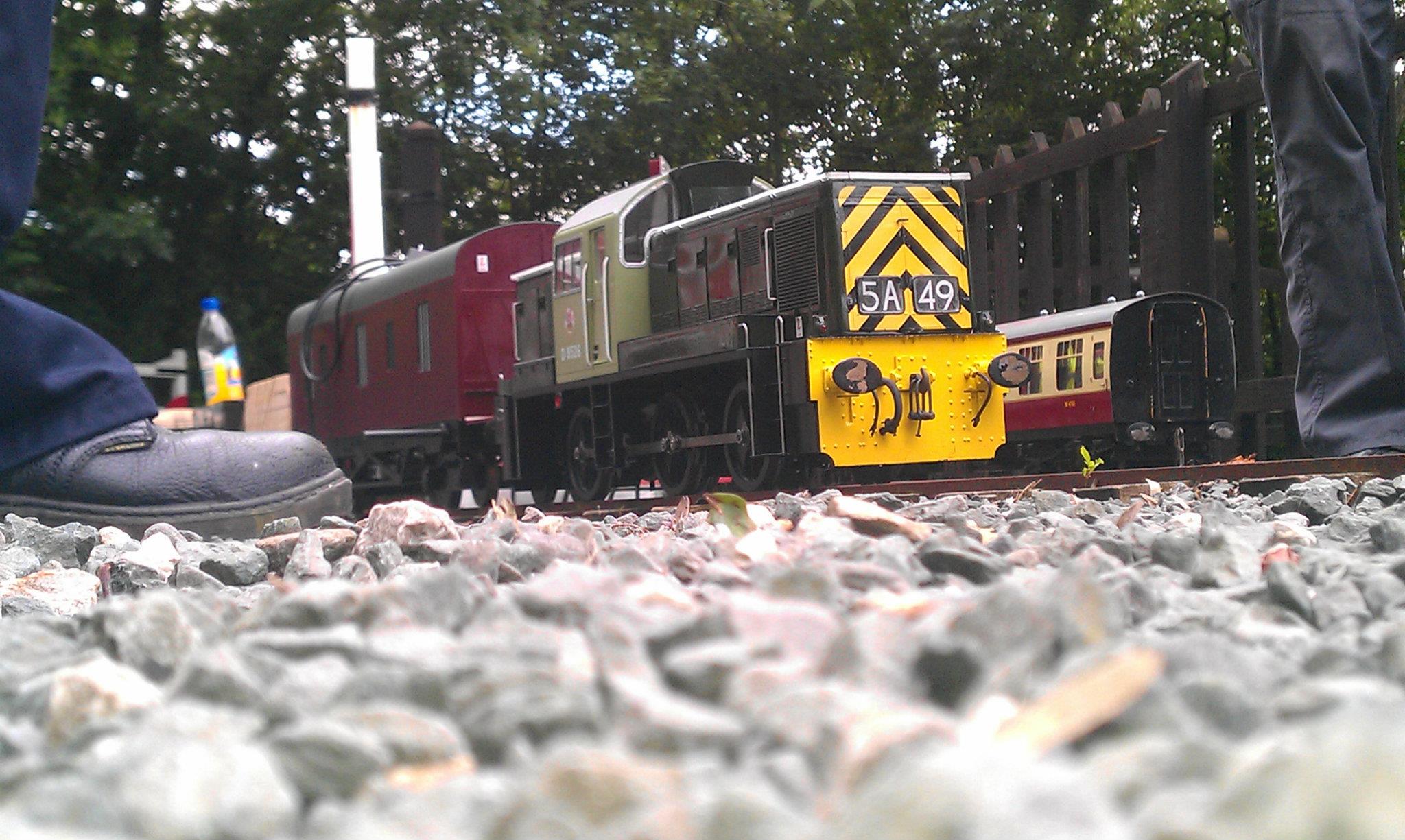 A finished Class 14 hauling a train, photographed from track level.