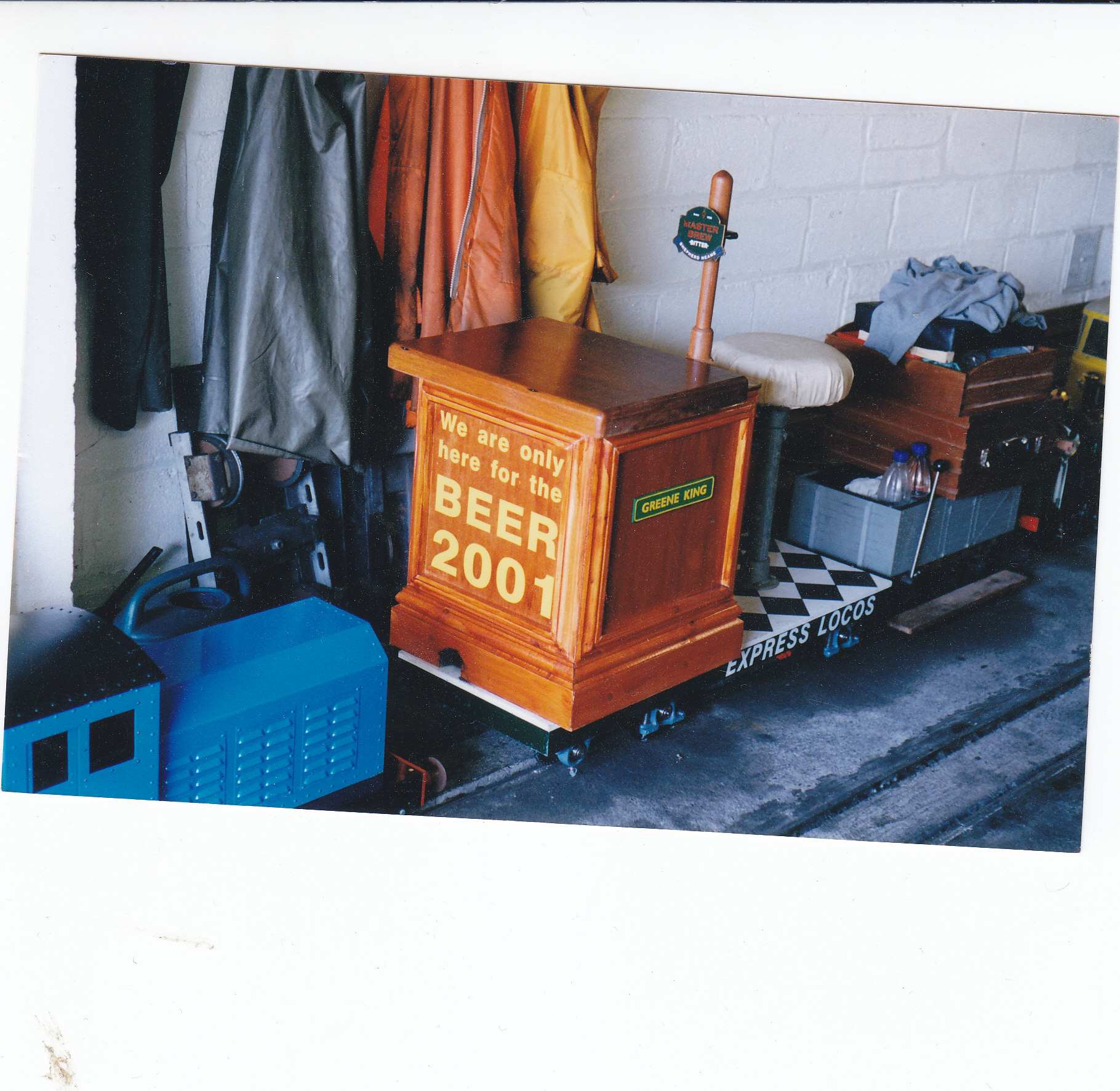 Greene King in 2001: the wooden bar body carries the words “We are only here for the BEER 2001”, with Express Locos lettering on the chassis.