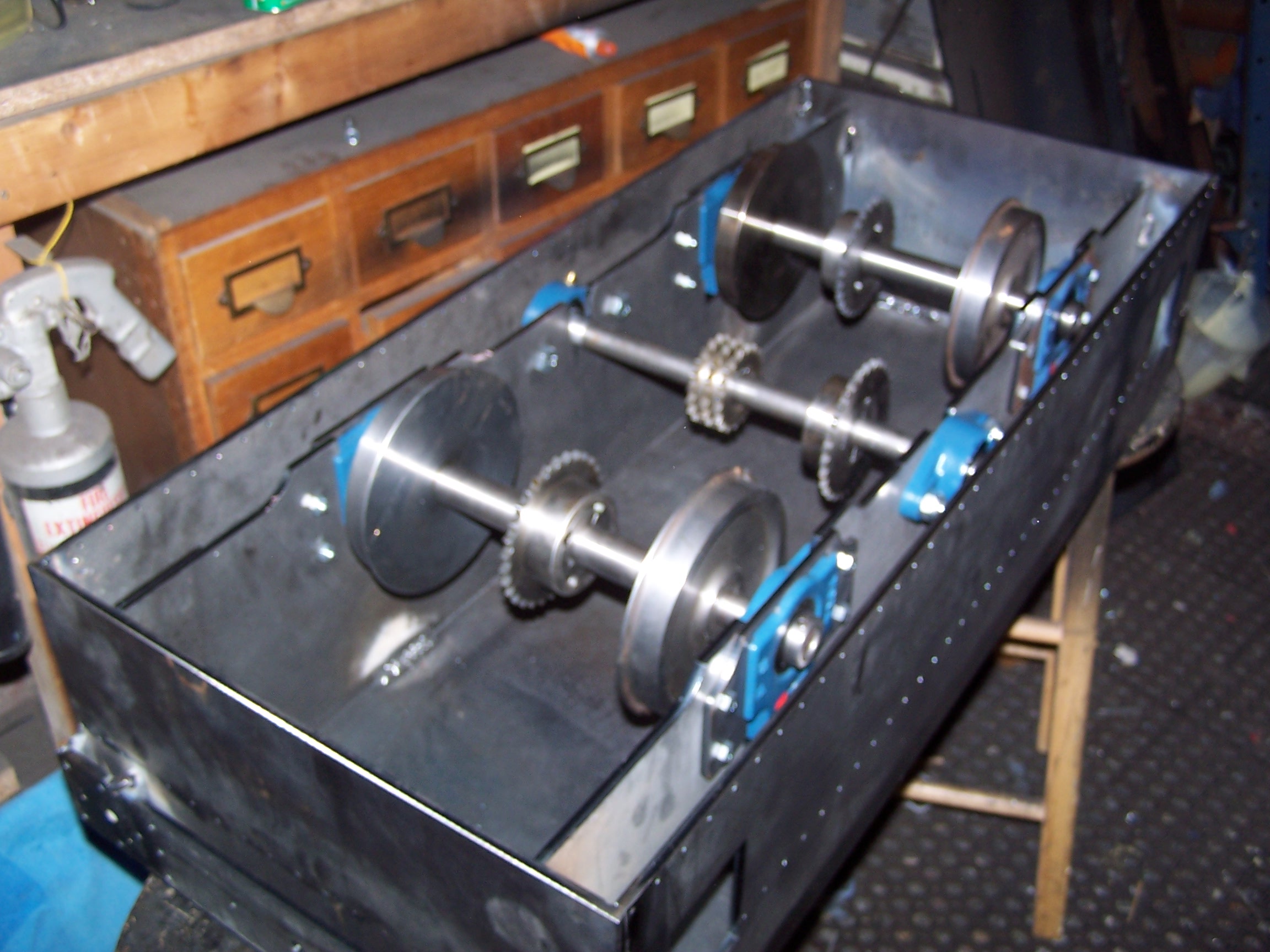Y6 tram chassis with the body lifted away, showing the chain drive.