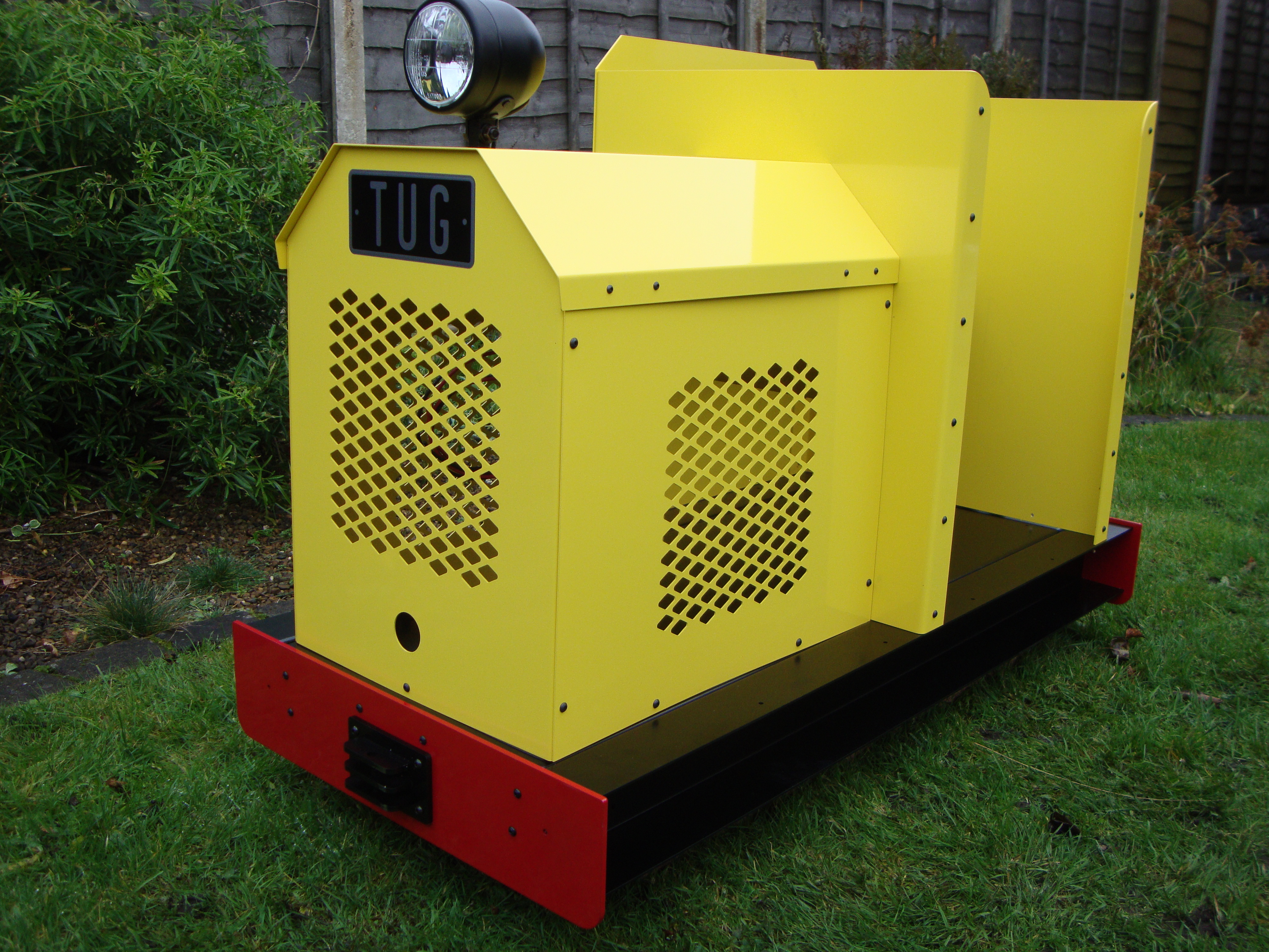 Yellow Tug ride-on locomotive from the Phoenix archive