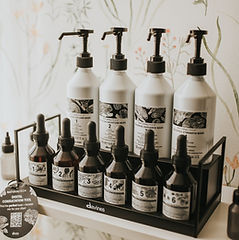 A variety of Davines hair care products displayed on a shelf at The Hair Lab in Calgary
