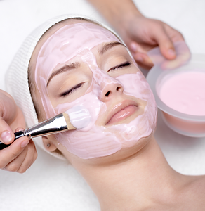 face mask being applied during skin treatment