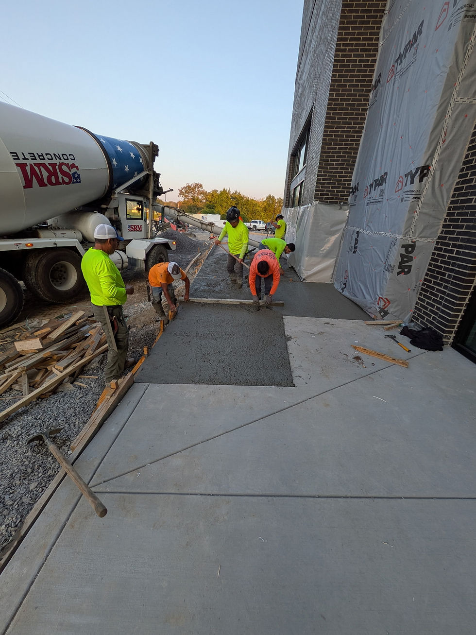 Halemeyer team pouring fresh concrete for commercial project.
