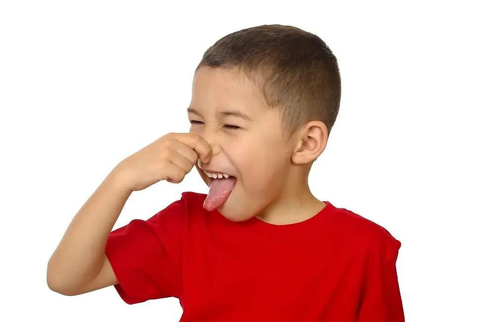 kid holding his nose from bad odor