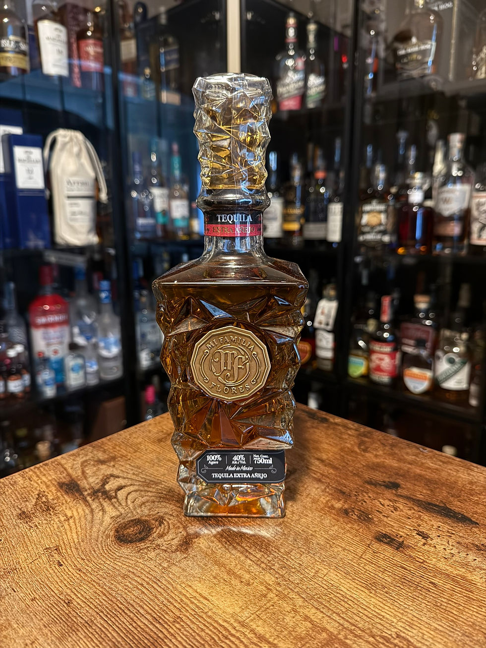 Bottle of Mi Familia Flores Extra Anejo Tequila