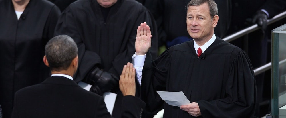 Justice Roberts hand raised