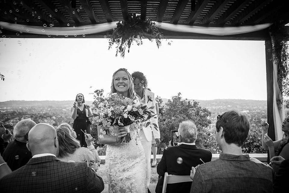 bride and groom walking down the aisle together
