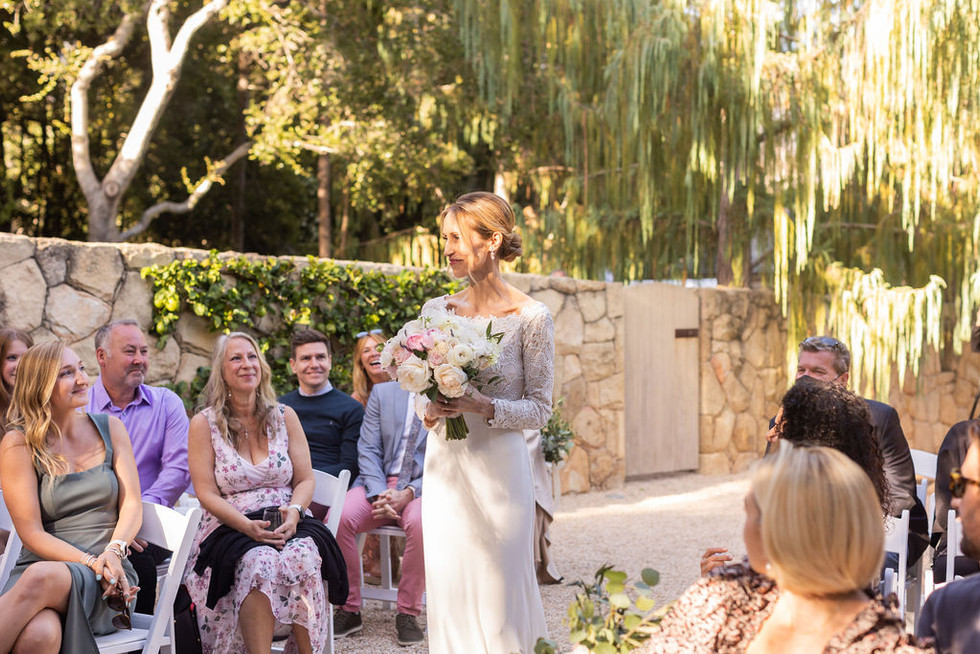 bride walking down the aisle for small wedding
