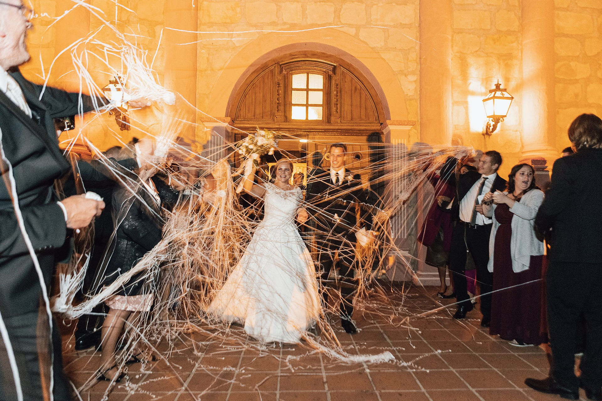 Wedding ceremony exit with streamers at Old Mission Santa Barbara
