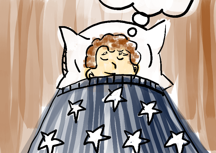 Menino deitado em cama sonhando