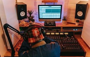 DJ at a radio mixing desk