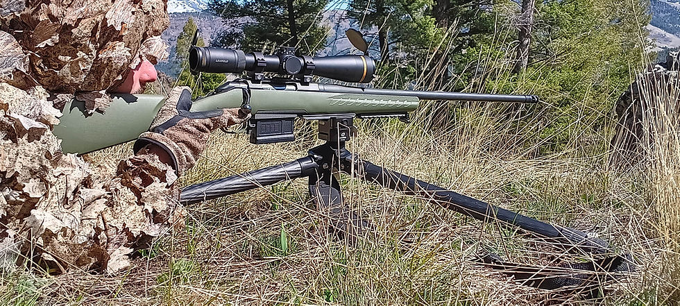 man aiming with an rifle.
