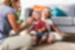 mother-feeding-kids-in-living-room-2023-11-27-05-31-10-utc.jpg