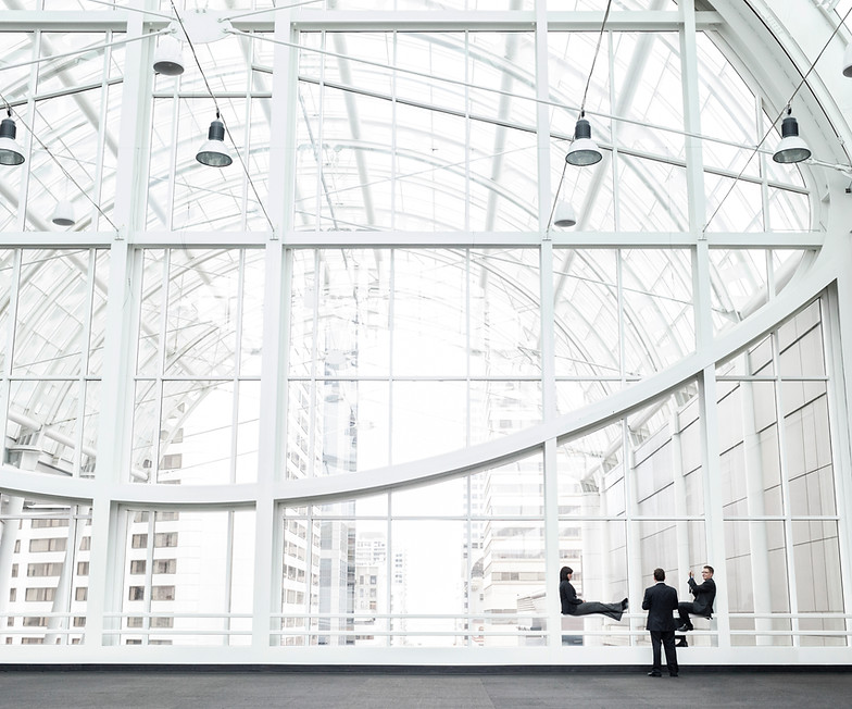 three-businesspeople-meeting-in-front-of-a-window-2025-04-04-05-15-40-utc.jpg