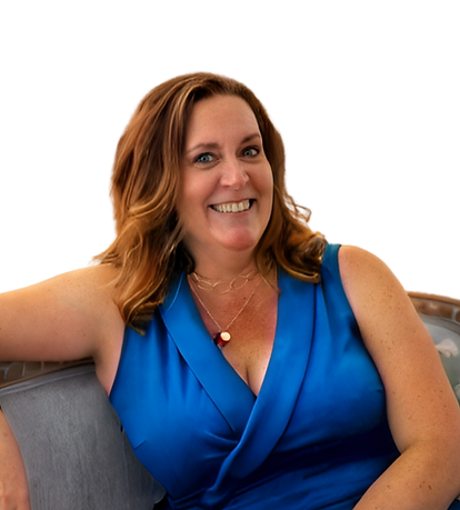 Coach Barbara Zinda sitting on a couch ready to help inspire, coach, and encourage her clients.