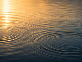Gentle ripples across calm water representing leadership character, lasting influence, and the impact of how we treat others.