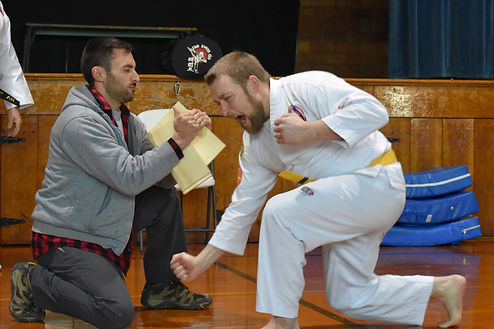Downward side fist board break