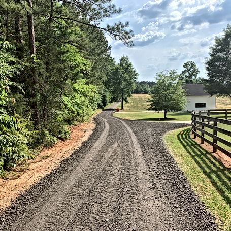 Beautiful Senoia home gets a brand new screened asphalt millings driveway.